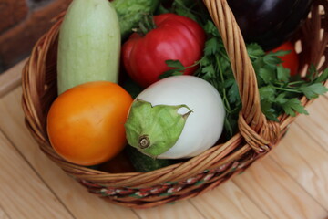Basket with vegetables. Tomato, eggplant, cucumber, zucchini. Organic food.