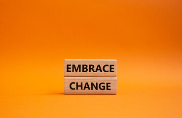 Embrace change symbol. Concept word Embrace change on wooden blocks. Beautiful orange background. Business and Embrace change concept. Copy space