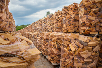 many stacks of natural chopped fire wood outdoor in natural daylight