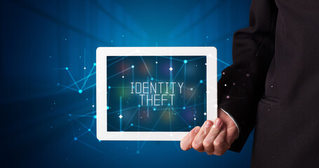 Person holding tablet, security concept