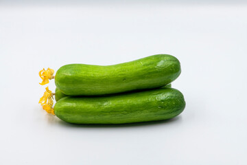 Select focused cucumbers on an isolated white background Cucumbers top view, food background. Macro Photo food cucumbers. Texture pattern background green cucumbers. Image fresh green cucumbers.
