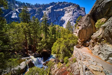 Gordijnen Hiking trail on cliffs overlooking waterfall and stunning Yosemite valley © Nicholas J. Klein