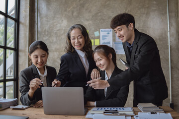 Successful business group celebrating at the office. Happy and cheering concept.