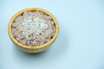  Selective Focused, Red chamba Puttu with coconut. Puttu is a South Indian and Sri Lankan breakfast dish which is steamed and layered with coconut. Healthy South Indian breakfast. with Babana leaf.