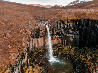Aerial view of the Svartifoss waterfall surrounded by basalt columns in the south of Iceland. Beautiful Icelandic nature.