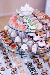 candy bar for the holiday. Table with various sweets, cupcakes decorated with fruits.