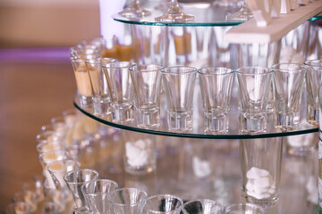 glasses stand on a stand on the buffet table preparing for the holiday