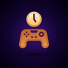 Gold Gamepad of time icon isolated on black background. Time to play games. Game controller. Vector