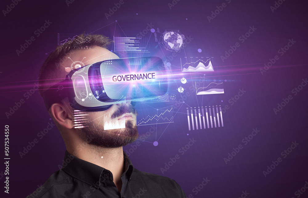 Wall mural businessman looking through virtual reality glasses