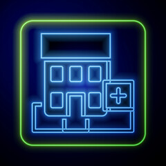 Glowing neon Medical hospital building with cross icon isolated on blue background. Medical center. Health care. Vector