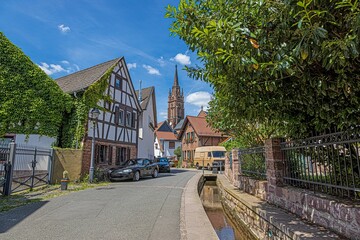 View to the historic city center of the German town Langen near Frankfurt in southern Hesse, Germany during daytime - obrazy, fototapety, plakaty