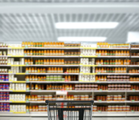 choosing a dairy products at supermarket.empty grocery cart in an empty supermarket