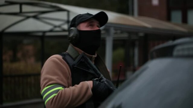 A masked Secret Service agent in close-up.
