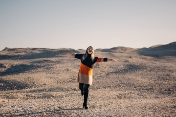 Happy woman in the desert.