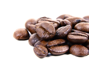 Roasted coffee beans isolated.Copy space. Heap of roasted coffee beans