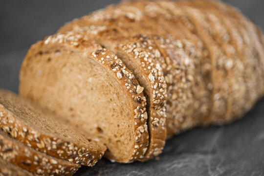 Close-up image of a bread cutting on a white background isolated dark background