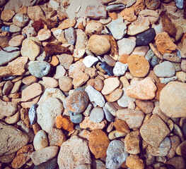 Brick brown. Rock pile. Rock background. Rock texture. Stone background. Paint spots. Rock surface with cracks. Grunge Rough structure. Abstract texture.