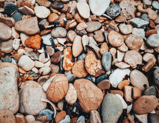 Brick brown. Rock pile. Rock background. Rock texture. Stone background. Paint spots. Rock surface with cracks. Grunge Rough structure. Abstract texture.