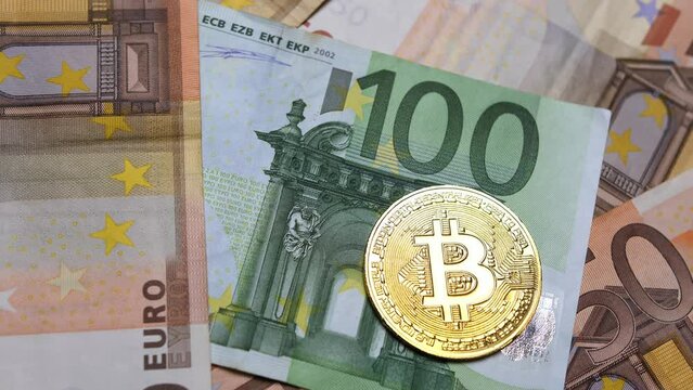 Bitcoin, cryptocurrency, golden bitcoins and real money. Euro currency