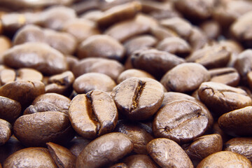 Roasted coffee beans background. Heap of roasted coffee beans