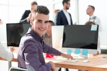 close up. young professional sitting at office Desk