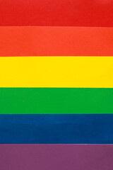 Rainbow LGBTQ or gay pride flag on colo paper texture. Abstract background for design.