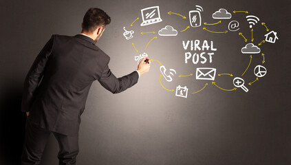 businessman drawing social media icons