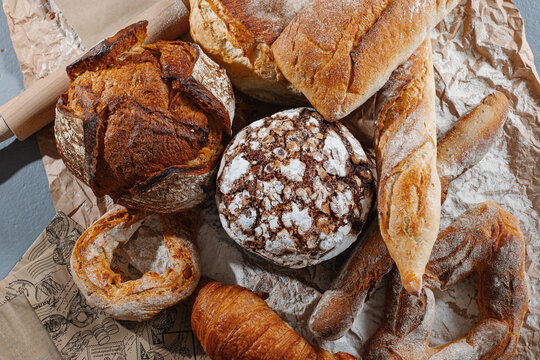 Assortment of delicious pastries on crumpled brown kraft paper