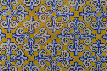 Decorative tiles on a building facade in the city of Valencia, in Spain.