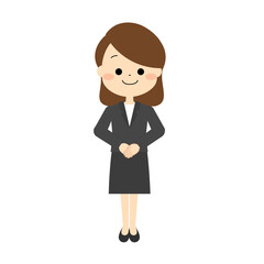 手を重ねて立っているスーツを着た女性