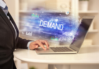 Closeup of businessman hands working on laptop