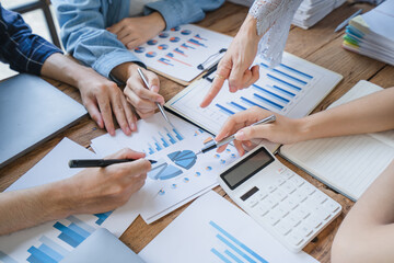 Financial Business man analyze the graph of the company's performance to create profits and growth,...