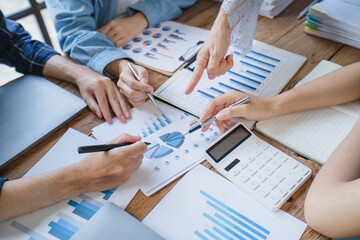 Financial Business man analyze the graph of the company's performance to create profits and growth,...