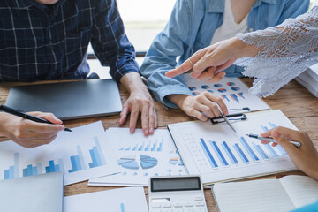 Financial Business man analyze the graph of the company's performance to create profits and growth,...