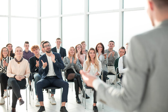 image of a speaker giving a lecture at a business seminar