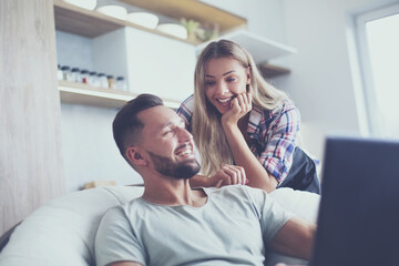 close up. young couple looking at laptop screen.