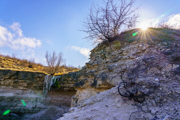 Frozen waterfall in the wild. Landscape background with copy space