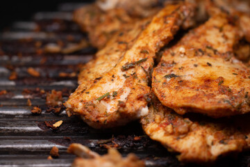 delicious grilled chicken fillet on the grill