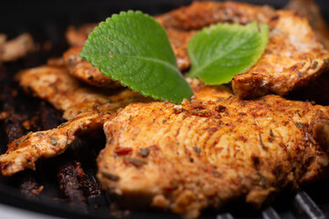delicious grilled chicken fillet on the grill