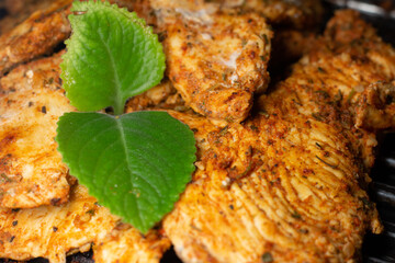 delicious grilled chicken fillet on the grill