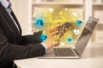 Doctor working on laptop with healthcare concept