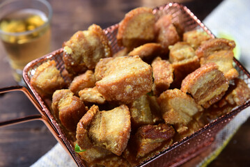 delicious fried pork rinds, typical Brazilian food served in a metal basket