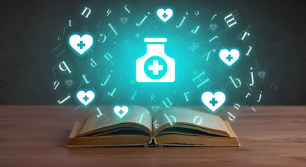 Open medical book with health icons above