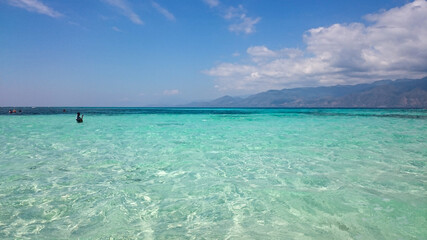 Fototapeta na wymiar Alor Island has a very beautiful beach. Beach with white sand and very clear water. Alor Island has stunning views and nature.