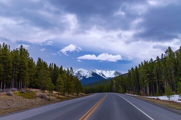 Fototapeta na wymiar Cloudy Blue Sky Over Mountain Roads