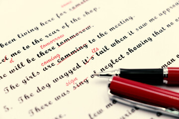proofreading of English sentences on white paperwork