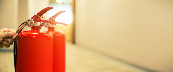 Fire extinguisher has hand engineer inspection checking pressure gauges to prepare fire equipment...