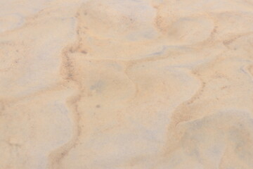 water flow and fine sand deposits