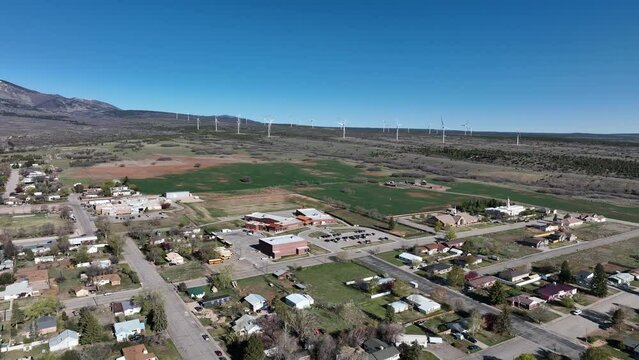 Aerial Monticello Utah homes hospital church pull part 1. Settled in July 1887 by pioneers from The Church of Jesus Christ of Latter-day Saints. Farming, ranching, and uranium mining. Mountain valley.