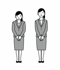 お辞儀をするスーツの女性